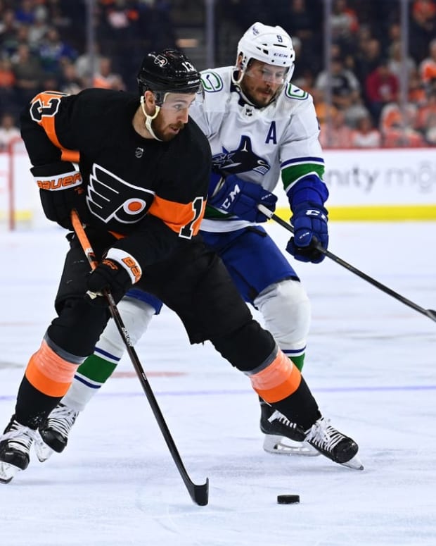 Oct 15, 2022; Philadelphia, Pennsylvania, USA; Philadelphia Flyers center Kevin Hayes (13) controls the puck ahead of Vancouver Canucks center J.T. Miller (9) in the first period at Wells Fargo Center. Mandatory Credit: Kyle Ross-USA TODAY Sports